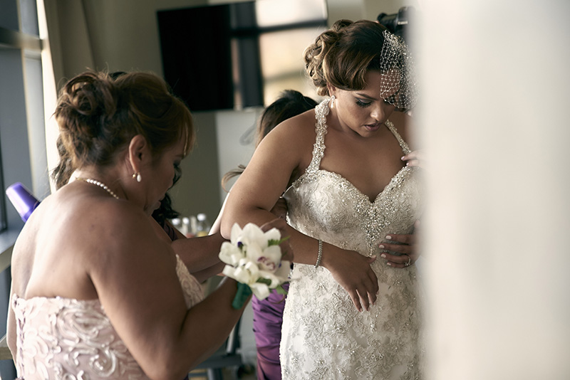 bride getting into dress