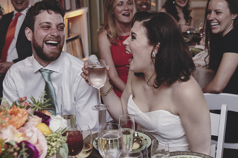 bride and groom laughing