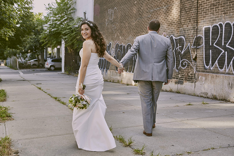 bride and groom walking on court st brooklyn