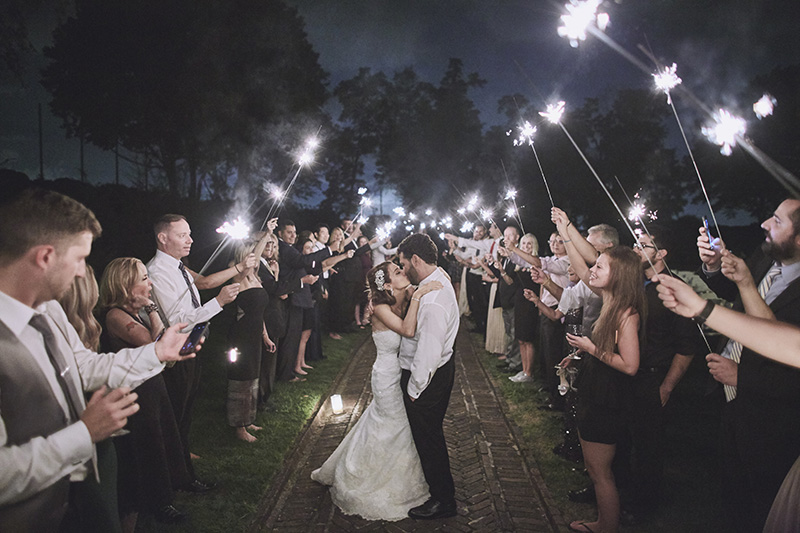bride and groom under sparklers 