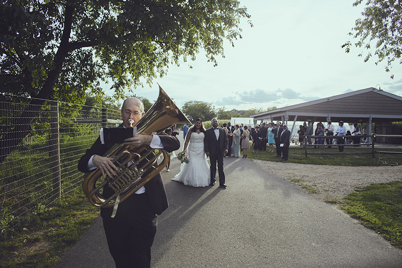 brass band following bride and groom