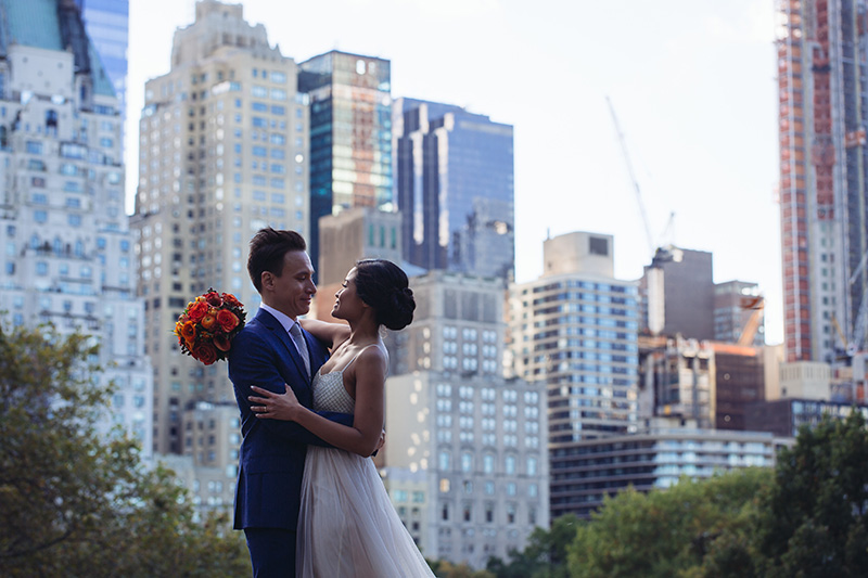wedding couple hugging on Central park rocks
