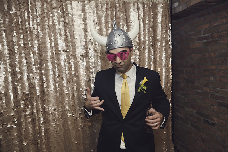 groom in photo booth
