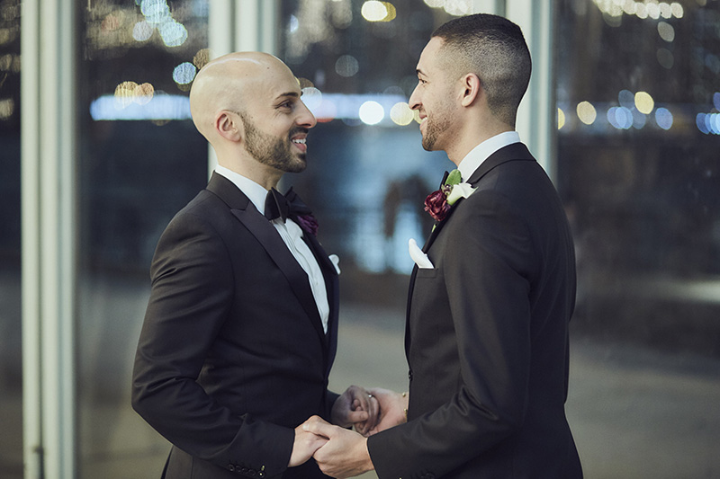 grooms holding hands