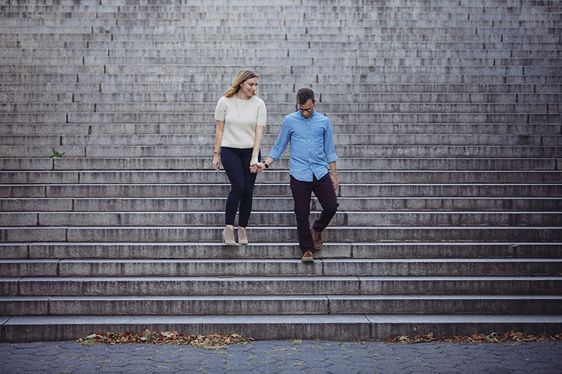 young couple walking down the steps 