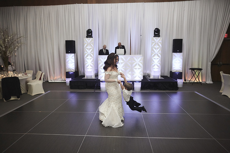 bride dancing with the her son  