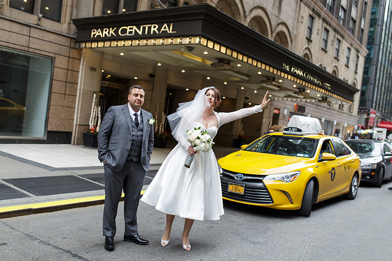 Bride hailing taxi