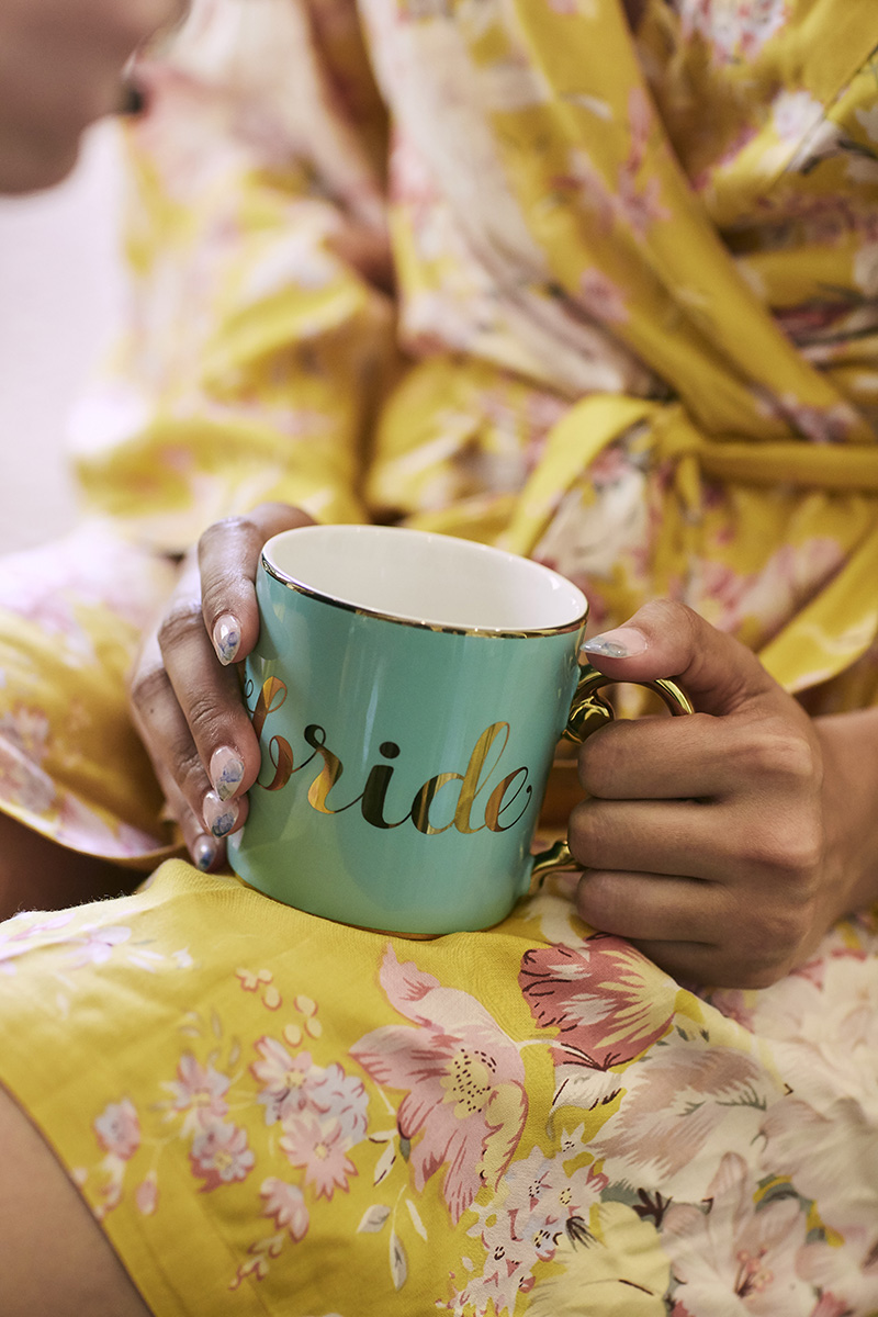 bride holding custom wedding cup