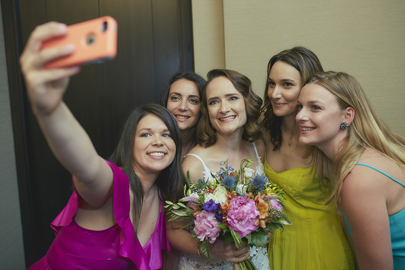 bridesmaids taking selfie