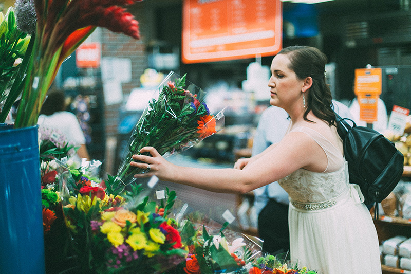 bride picking bouquet 