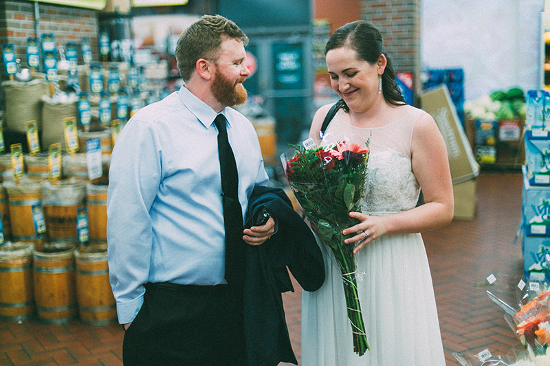 bride and groom buying flowers
