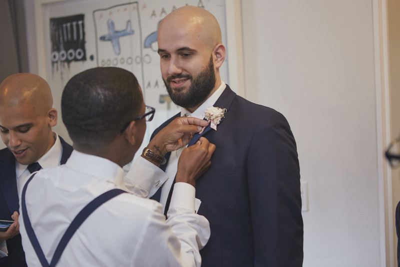 putting on the boutonniere