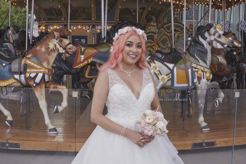 bride in front of the carousel