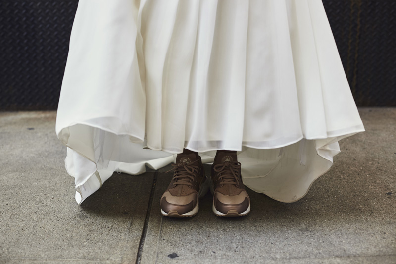 bride showing wedding shoes 