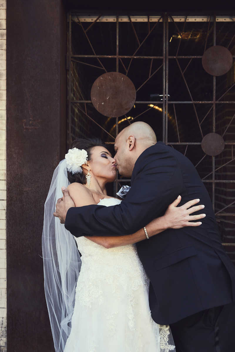 Groom and bride kissing