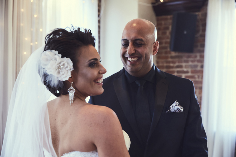 Groom and bride smiling