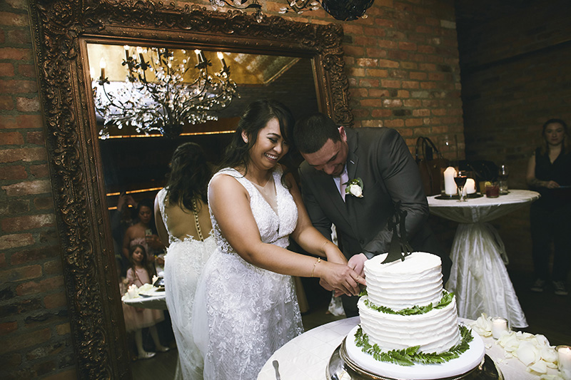Bride and groom cutting the cake