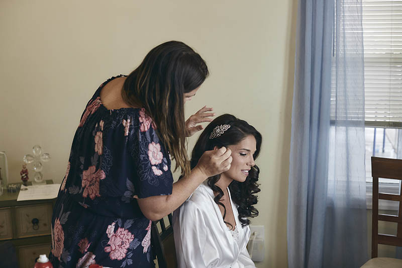 bride fixing her hair