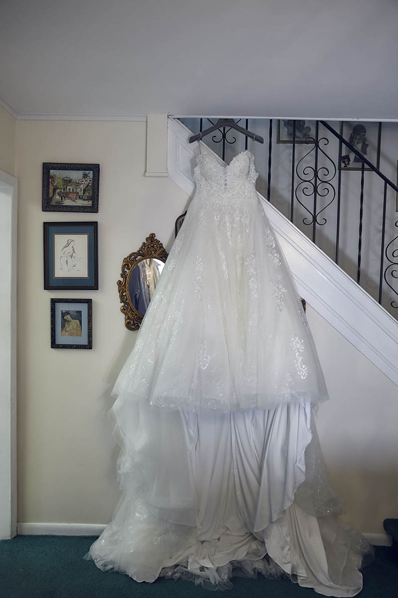 Bride's wedding dress hanging