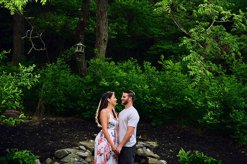 Couple looking at each other in the woods