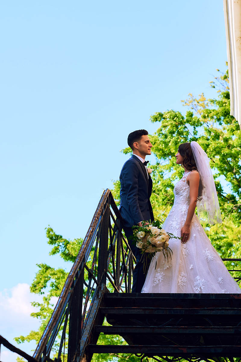 Bride and groom on top of fire escape