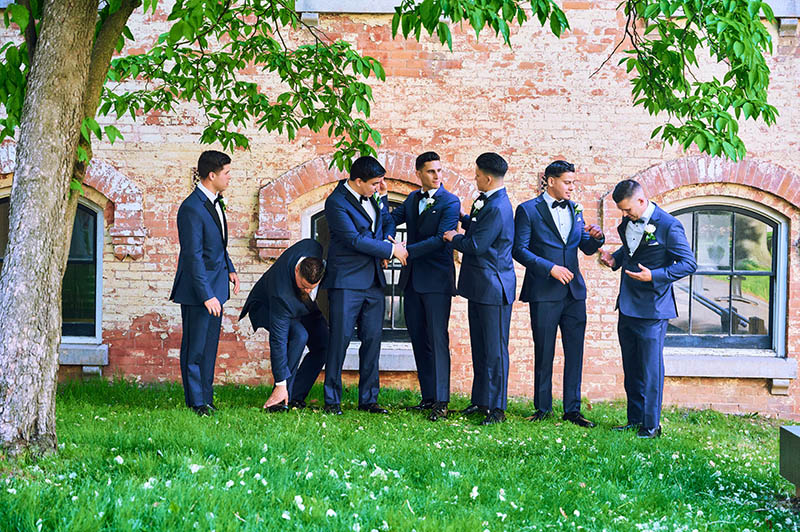 Groomsmen getting ready for a photo