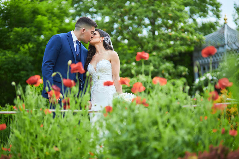 Couple kissing in tullip garden