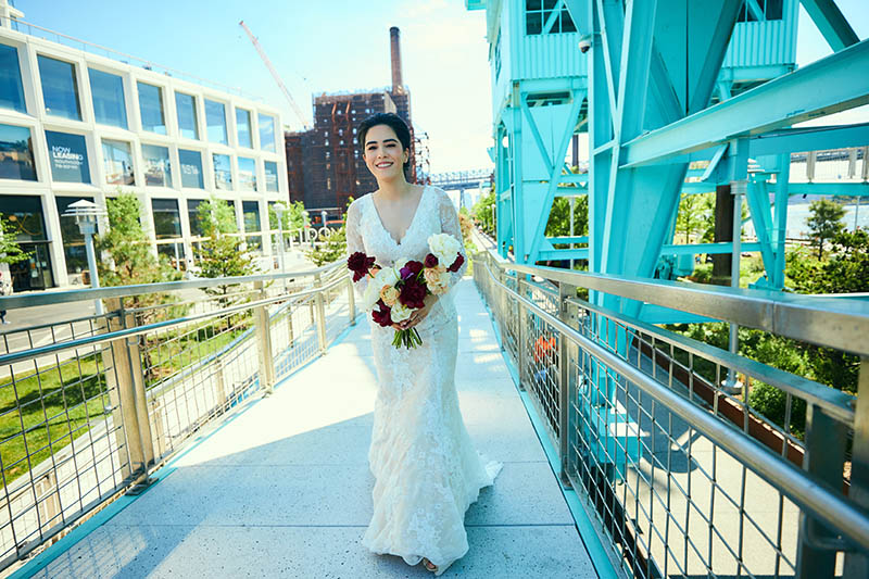 Bride walking to first look in white dress