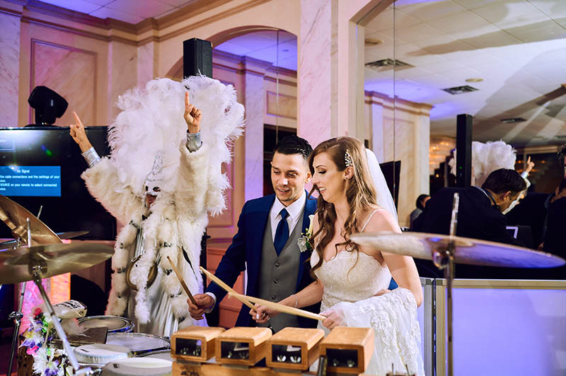 Bride and groom playing drums