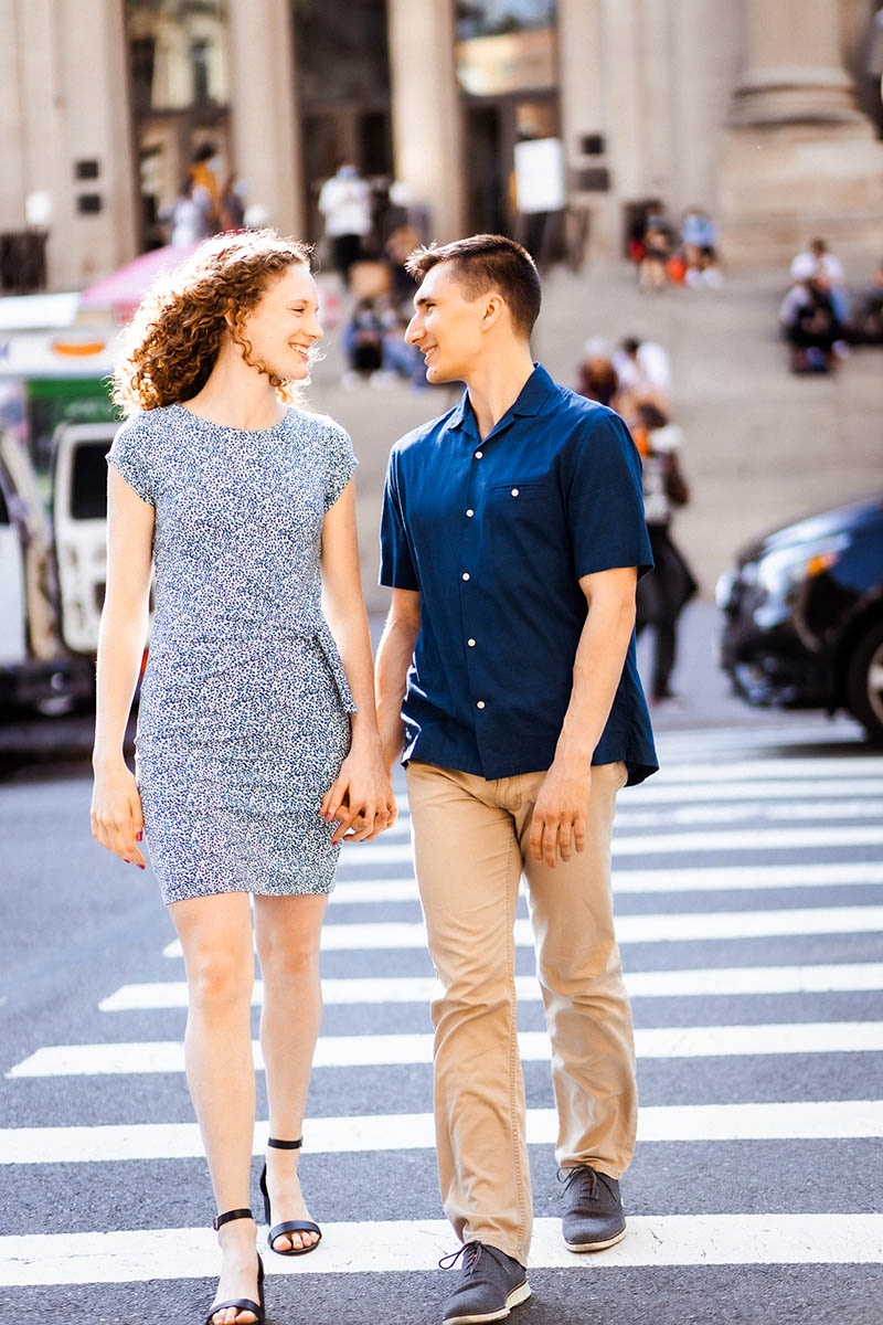Couple crossing the street in front of Met Museum