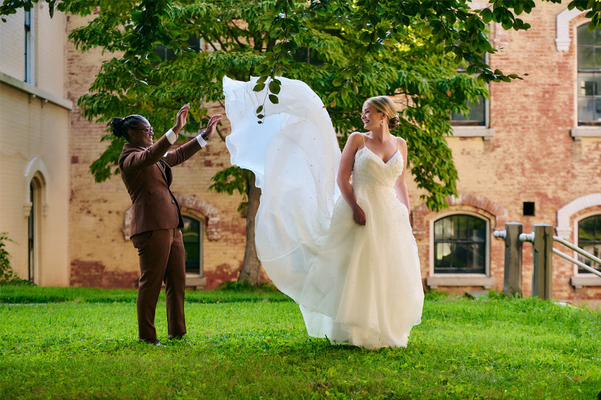 Bride playing with brides dress