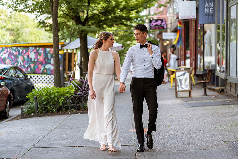 Bride and groom walking on street in Brooklyn