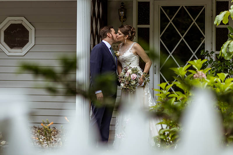 Couple kissing on the porch
