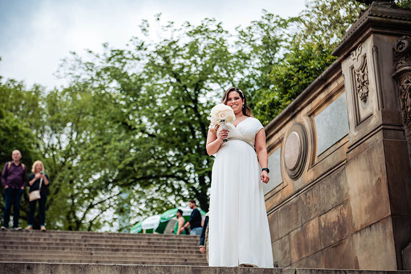Bride standing on stairs at Bethesda Terrace