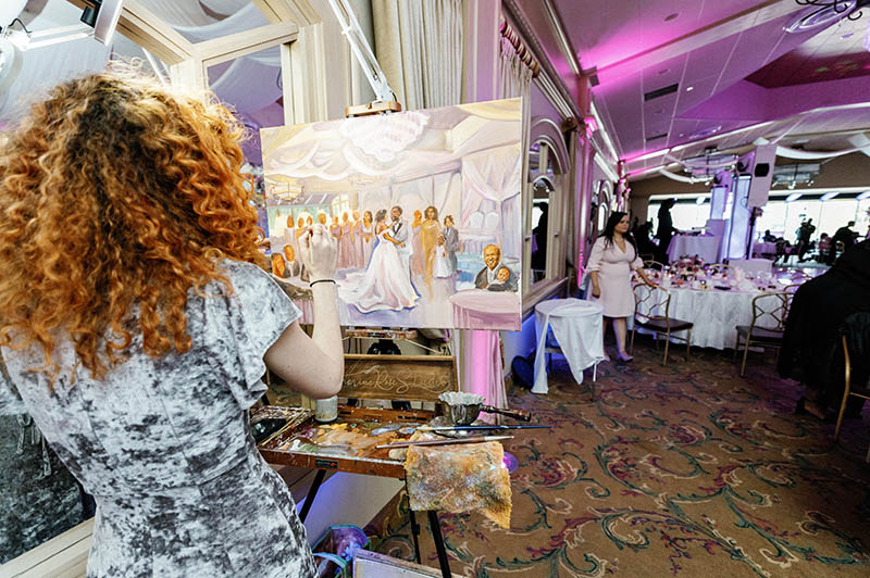 Artist painting wedding reception