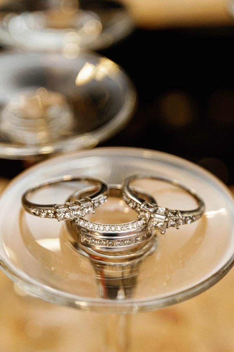 Wedding rings on bottom of glass