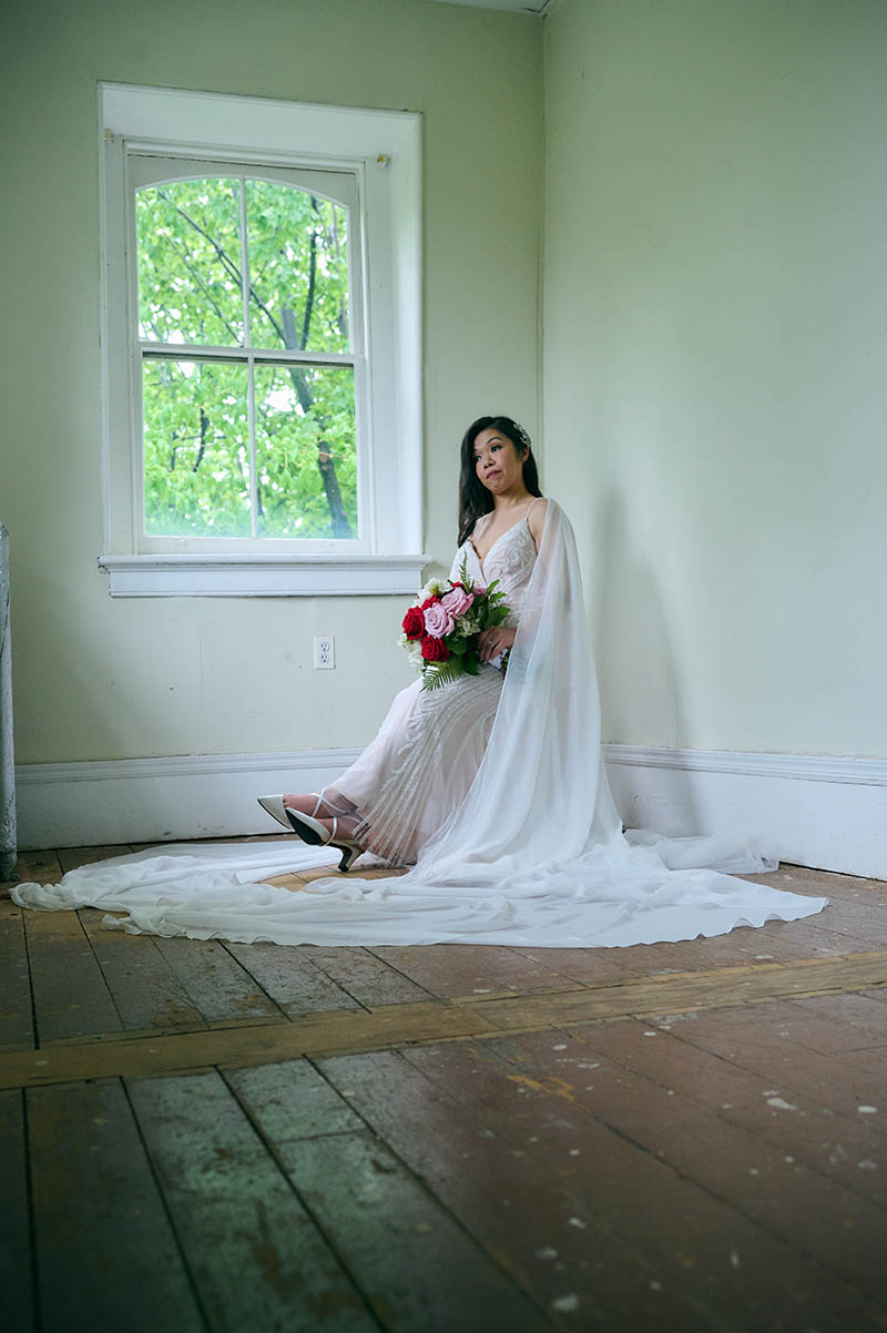 Bride sitting in chair in the corner