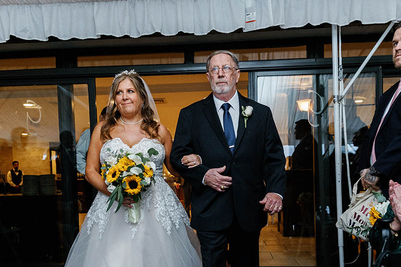 Bride walking down the aisle with father
