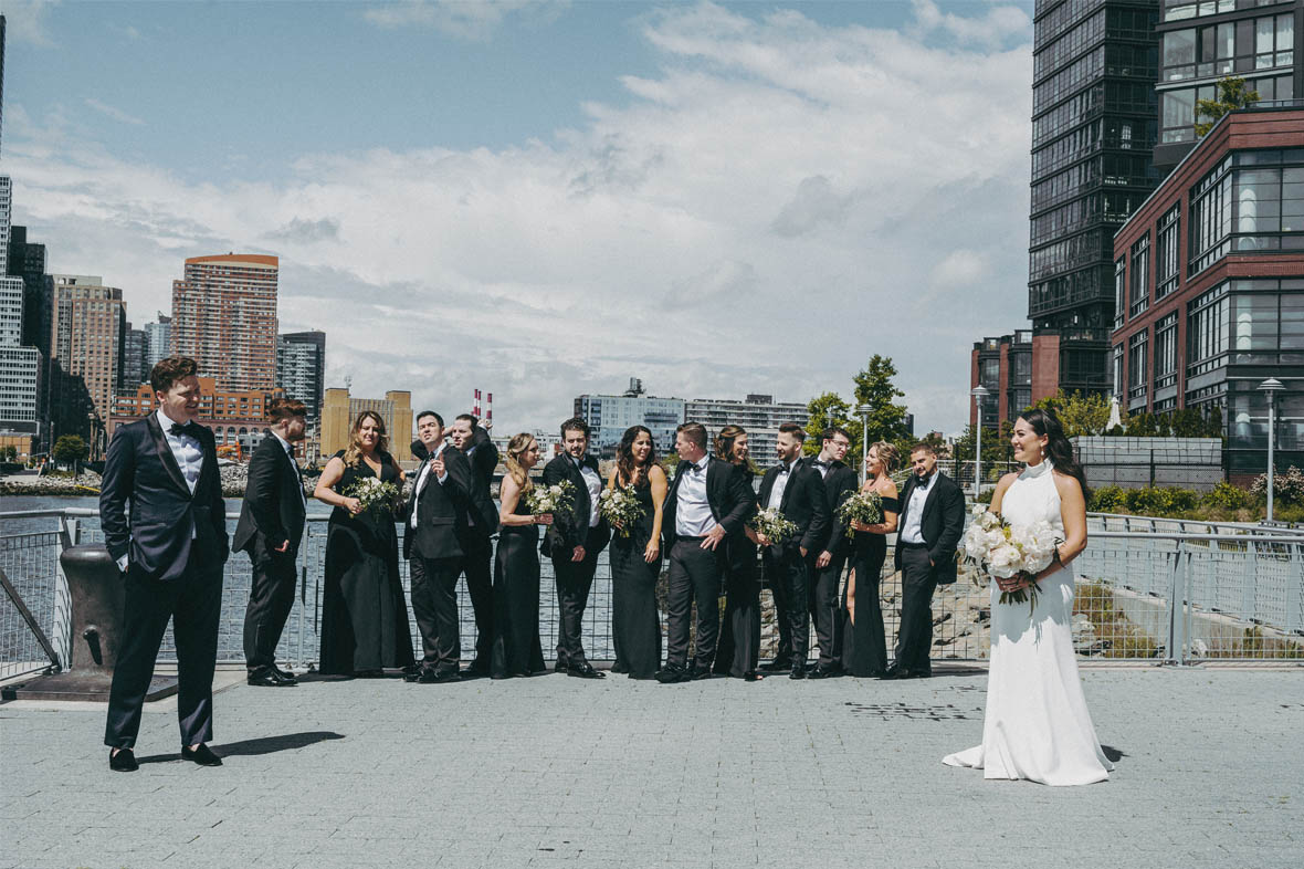 Bride and groom portrait with bridal party