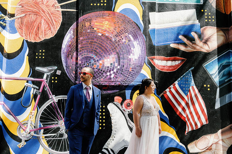 Bride and groom portrait against the graffiti wall