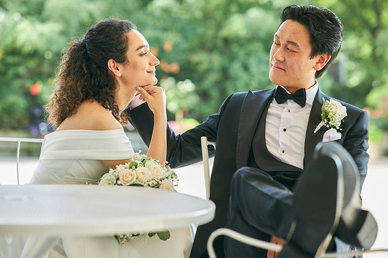 Groom sitting on chair with his legs up