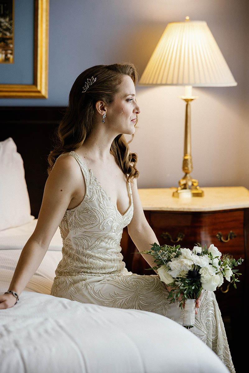 Bride sitting on bed