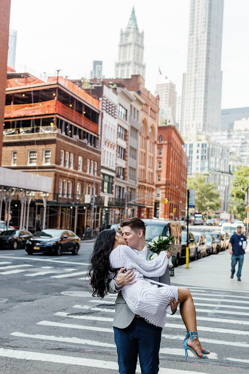Groom holding bride on NYC street