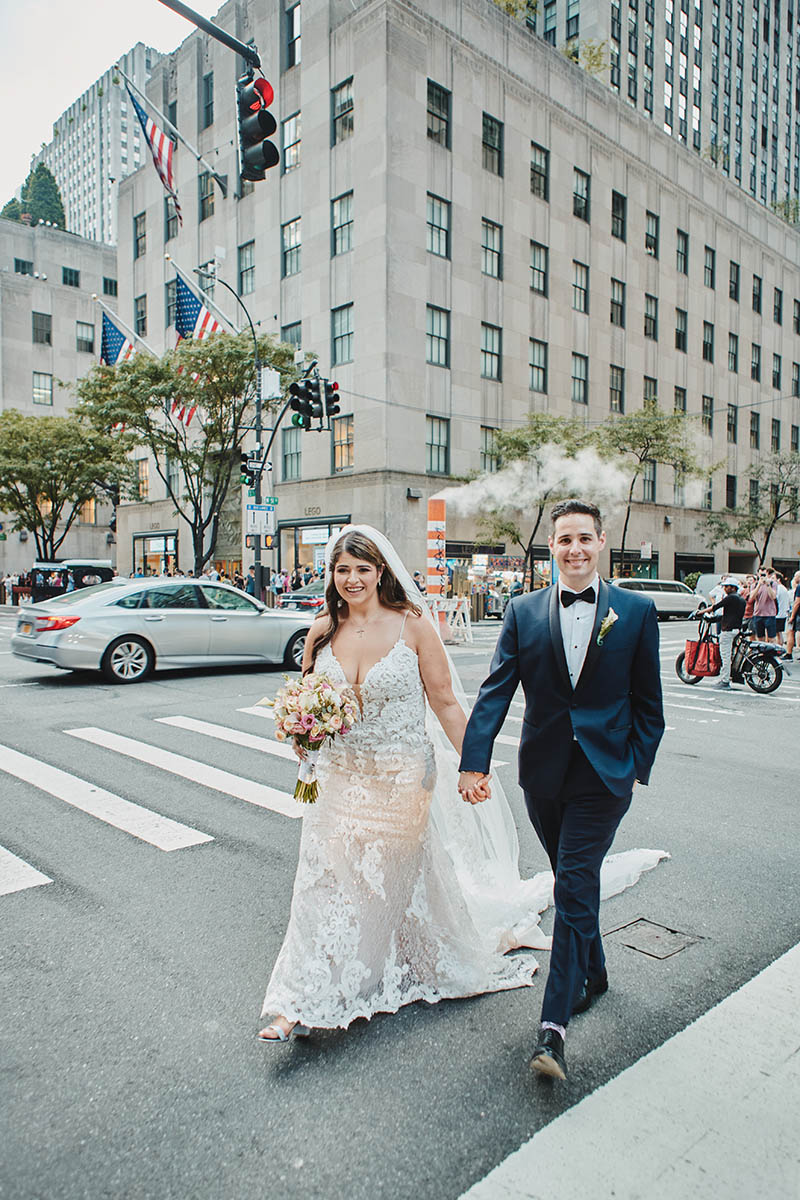 Bride and groom walking on NYC street