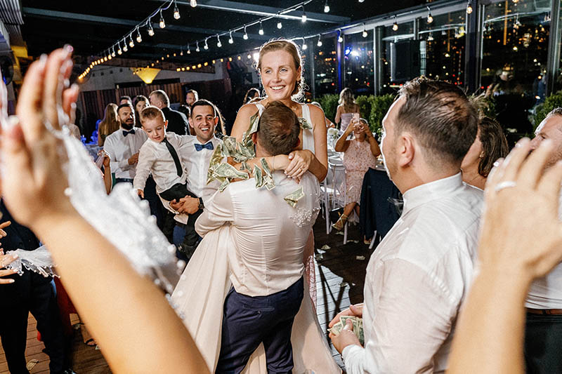 Groom hugging bride on dance floor