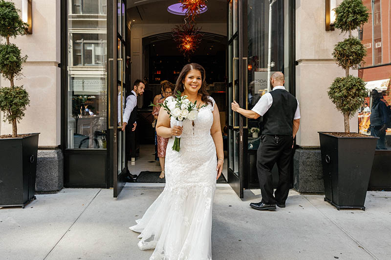 Bride walking out of hotel