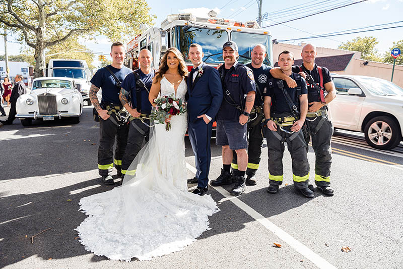 Bride and groom with firemen