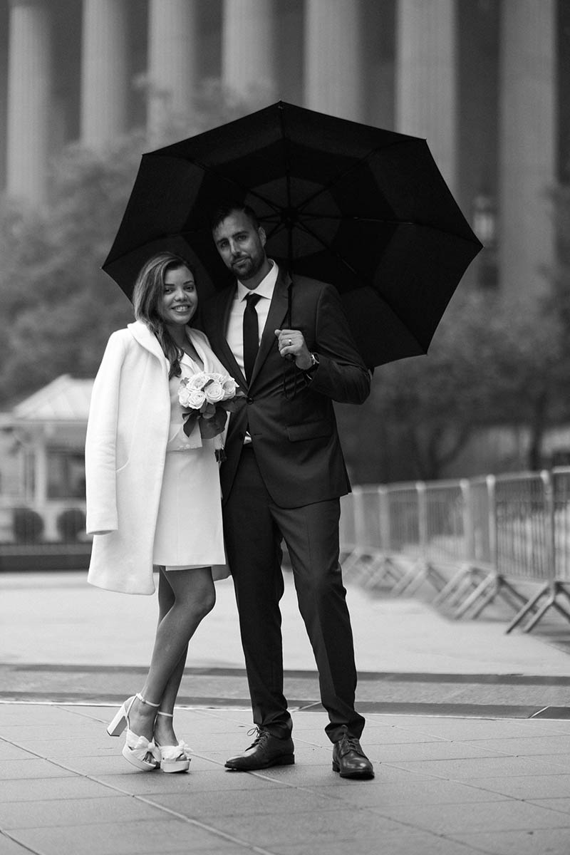 Couple holding umbrella