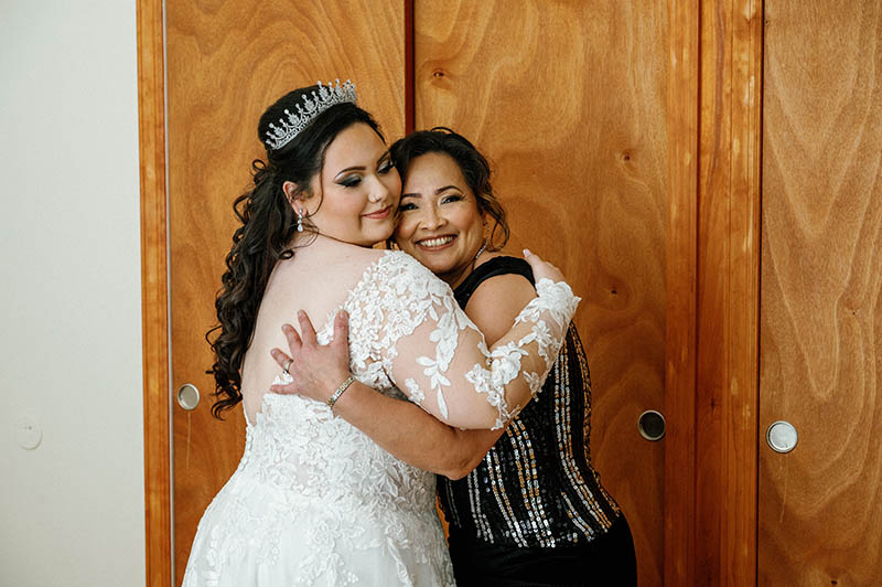 Bride hugging mom