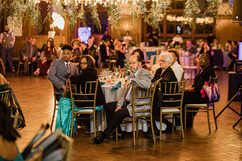 Guests listening to wedding toast